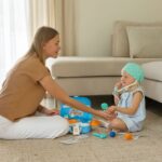 a mother and daughter play with a toy doctor kit in a cozy living room setting.