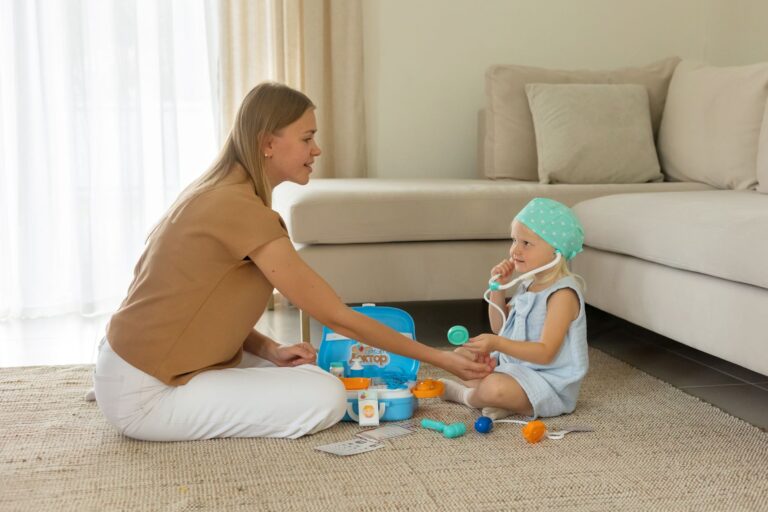 a mother and daughter play with a toy doctor kit in a cozy living room setting.