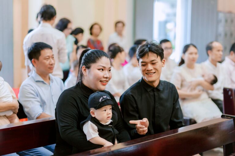 a family enjoys time together in a church setting, filled with warmth and happiness.