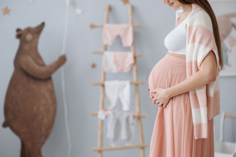 expectant mother caressing her belly in a cozy nursery room setting, symbolizing love and anticipation.
