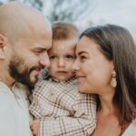 a joyful close-up of a happy family embracing outdoors, capturing warmth and love.