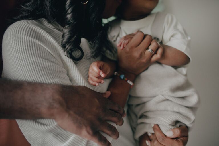a close-up of a loving family embrace, highlighting the warmth and connection between parent and child.