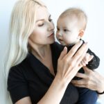 a tender moment of a mother holding her baby, showing love and connection.