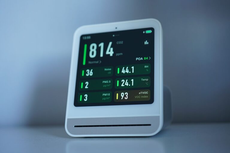 a sleek air quality monitor showing co2 and other air metrics, ideal for smart homes.